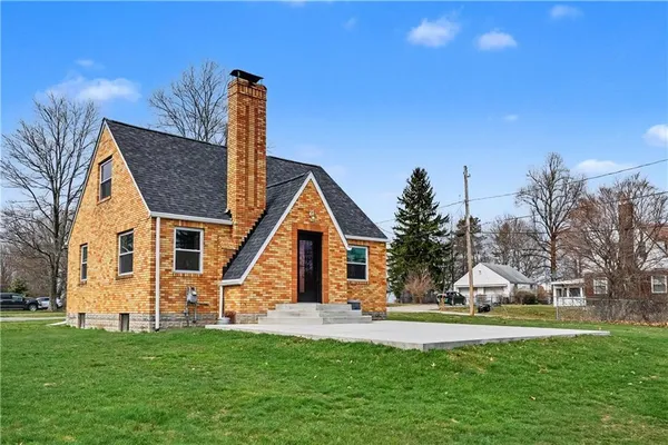 a front view of a house with garden