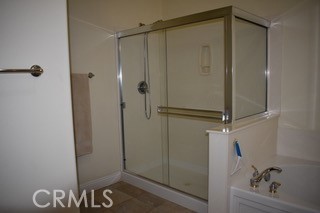 1746 Dalea Way Beaumont, CA 92223 - Photo 14 of 35 a bathroom with a shower and a glass door