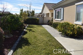 1746 Dalea Way Beaumont, CA 92223 - Photo 23 of 35 a front view of a house with a yard