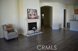 1746 Dalea Way Beaumont, CA 92223 - Photo 27 of 35 a living room with furniture and a fireplace
