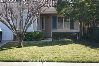 1746 Dalea Way Beaumont, CA 92223 - Photo 3 of 35 a view of a yard in front of a house with large trees