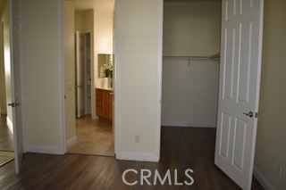 1746 Dalea Way Beaumont, CA 92223 - Photo 6 of 35 a view of a hallway with wooden floor