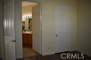 1746 Dalea Way Beaumont, CA 92223 - Photo 7 of 35 a view of hallway with sink and wooden door