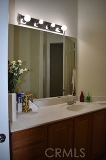 1746 Dalea Way Beaumont, CA 92223 - Photo 8 of 35 a bathroom with a sink and a mirror