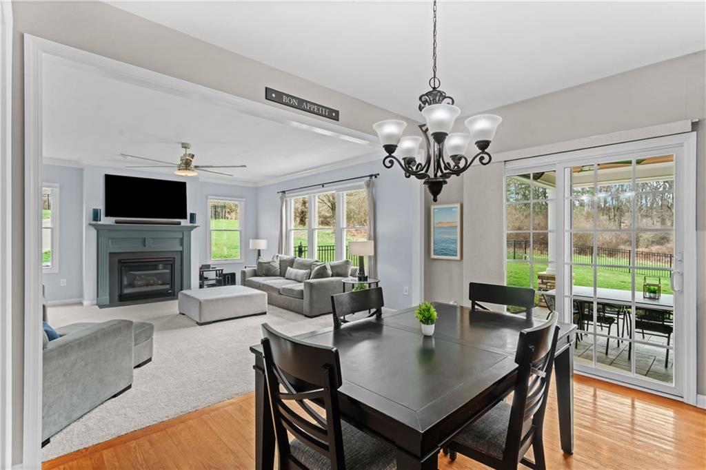 237 Morning Grove Lane Valencia, PA 16059 - Photo 11 of 50 a view of a dining room with furniture a livingroom and chandelier