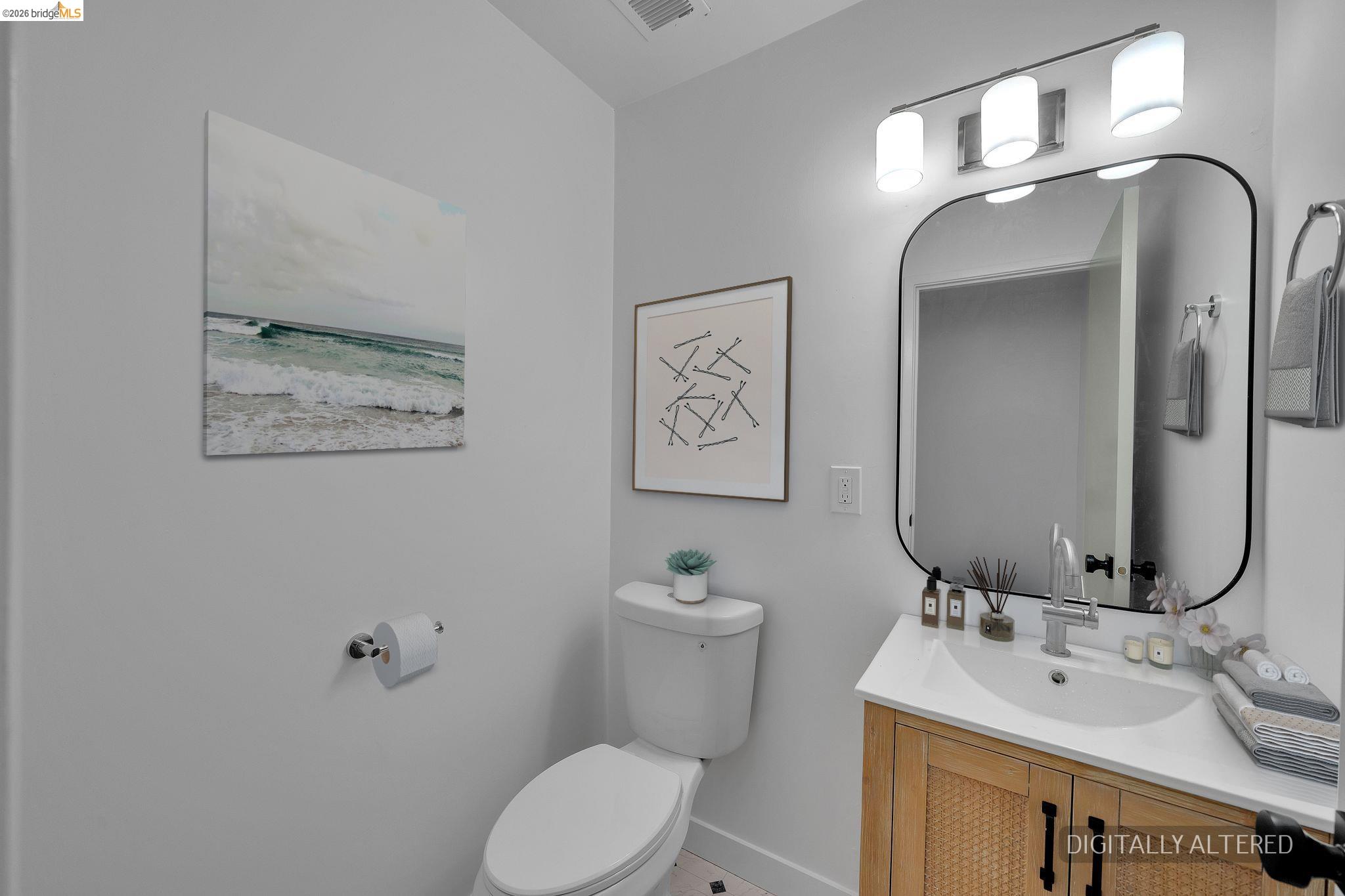 1808 Wildbrook Court, Unit D Concord, CA 94521 - Photo 20 of 47 a bathroom with a toilet sink and mirror