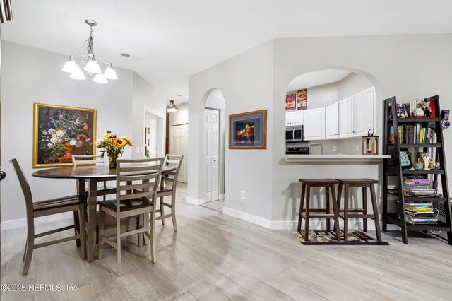 a bedroom with a bed and a mirror