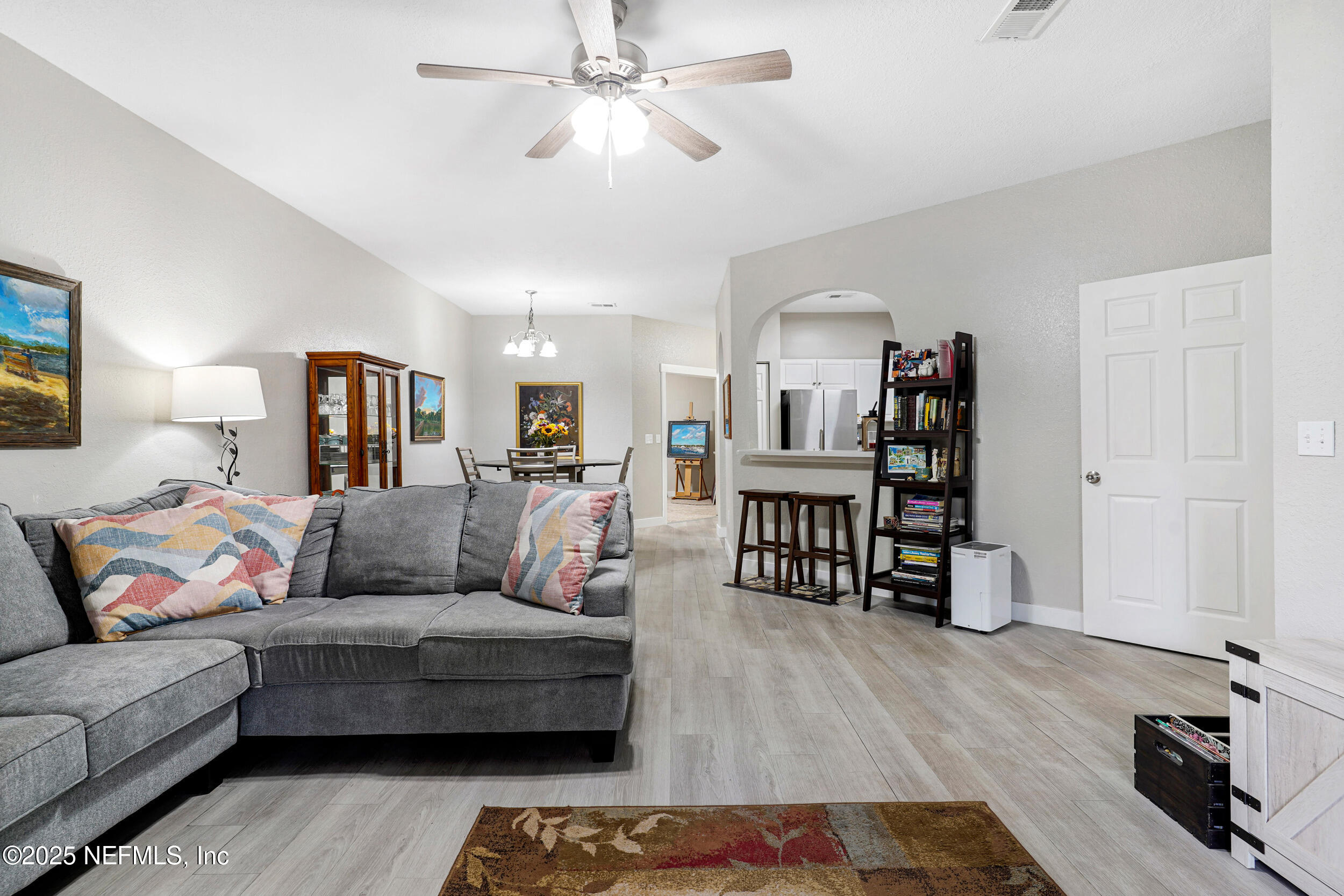 1125 Vista Cove Road St. Augustine, FL 32084 - Photo 15 of 62 a living room with furniture and wooden floor