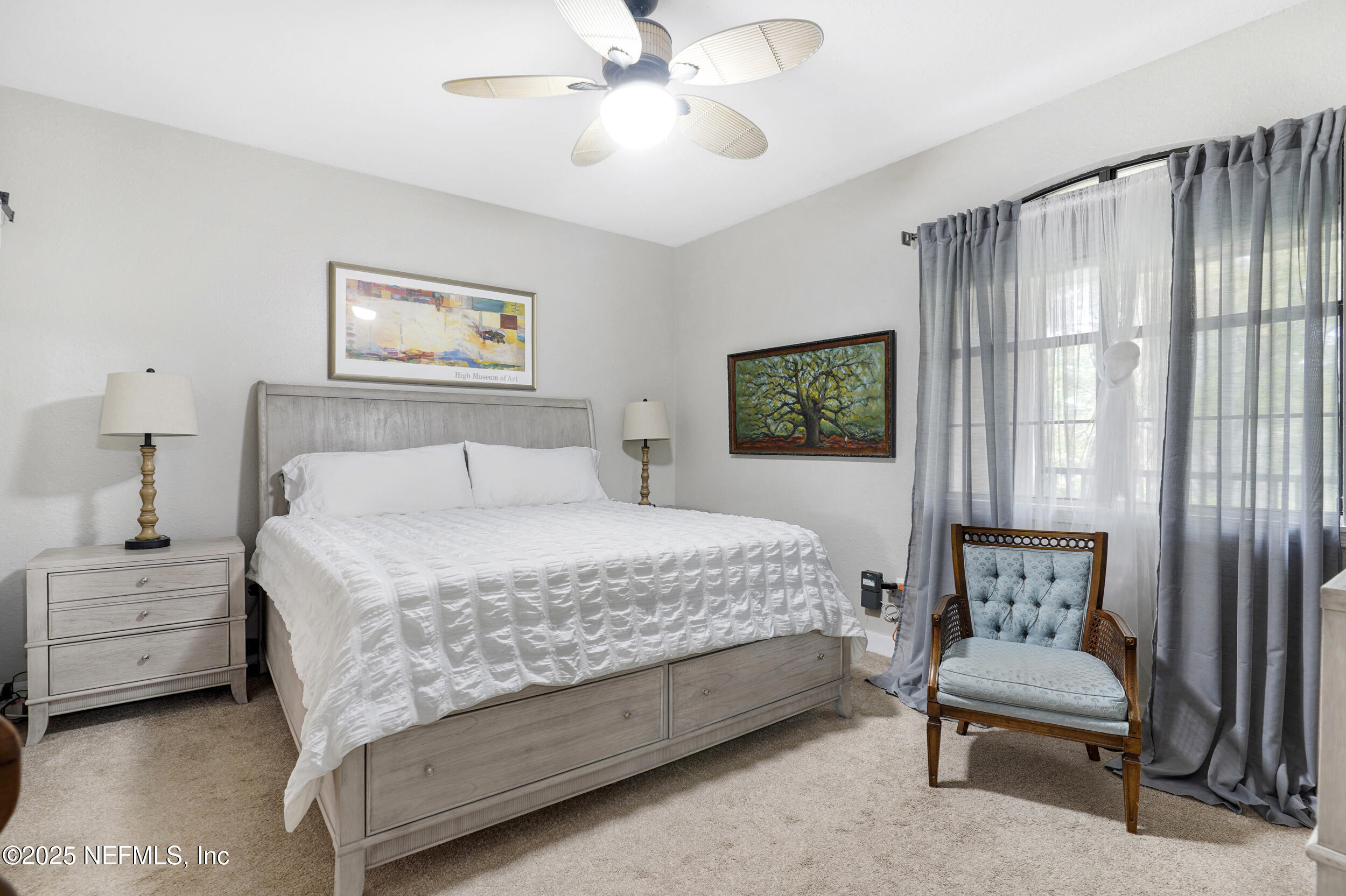 1125 Vista Cove Road St. Augustine, FL 32084 - Photo 16 of 62 a bedroom with a bed and a painting on the wall