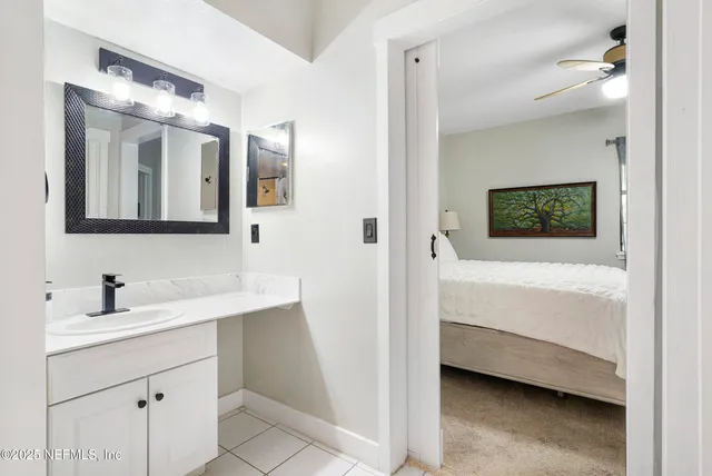 a living room with furniture a rug and a flat screen tv