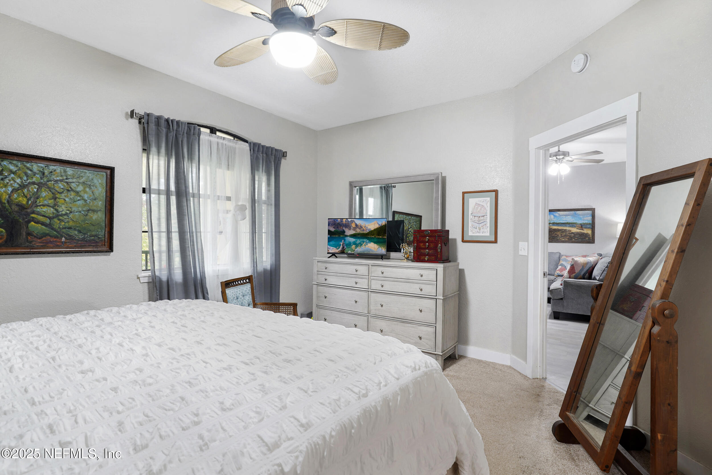 1125 Vista Cove Road St. Augustine, FL 32084 - Photo 20 of 62 a bedroom with a bed and a flat screen tv
