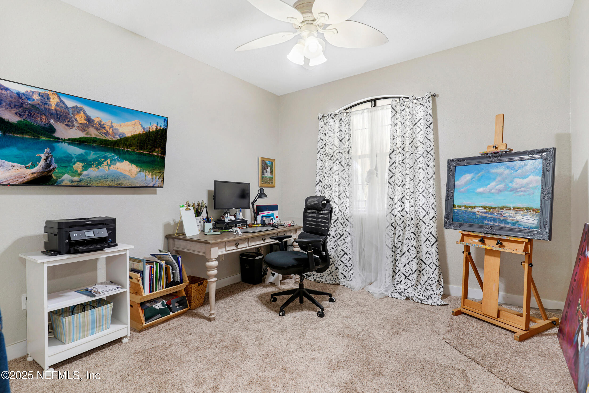 1125 Vista Cove Road St. Augustine, FL 32084 - Photo 27 of 62 a view of a workspace with furniture and a flat screen tv
