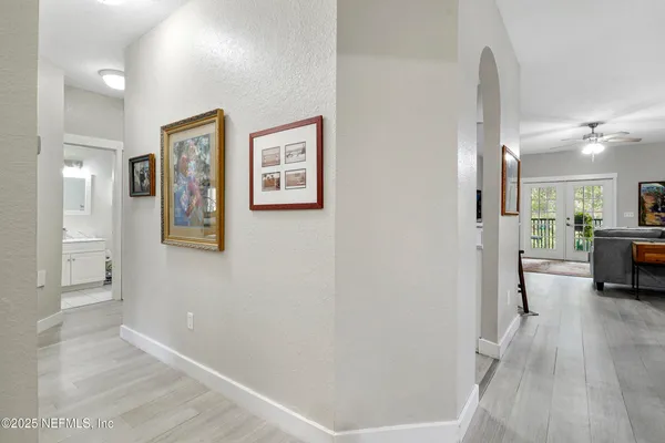 a view of walk in closet with clothes