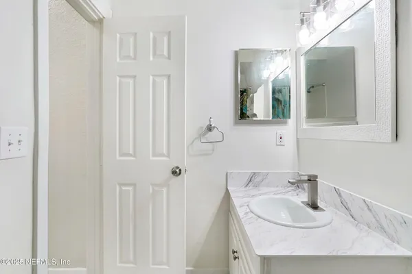 a view of a lake with a house in the background