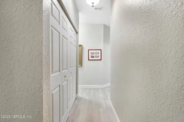 a view of a lake with a house in the background