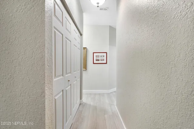 a view of a lake with a house in the background