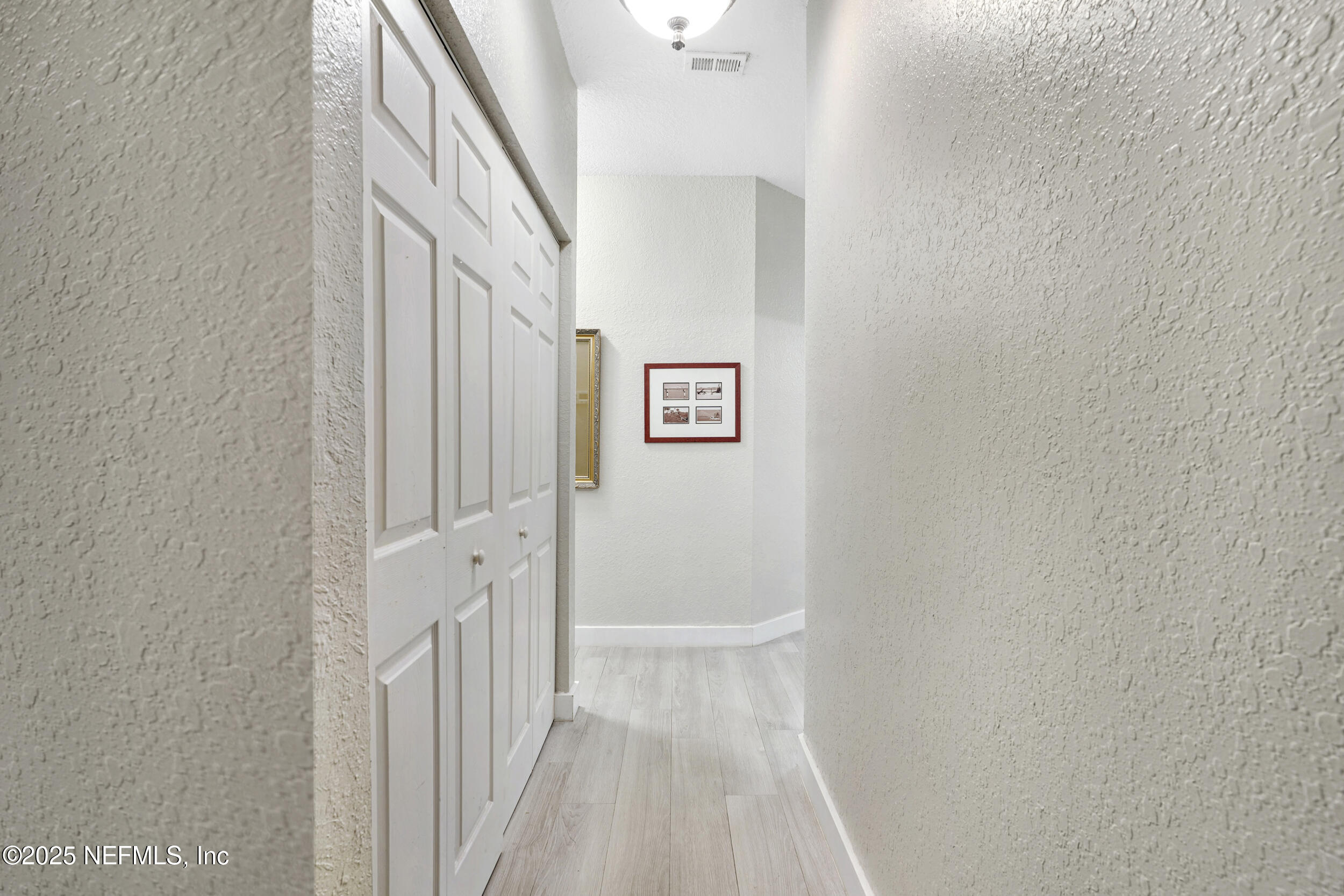1125 Vista Cove Road St. Augustine, FL 32084 - Photo 36 of 62 a view of a hallway with staircase