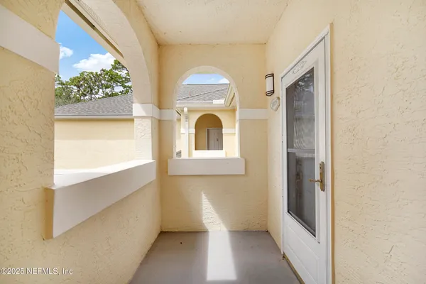 an aerial view of residential houses with outdoor space and river