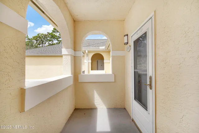 an aerial view of residential houses with outdoor space and river