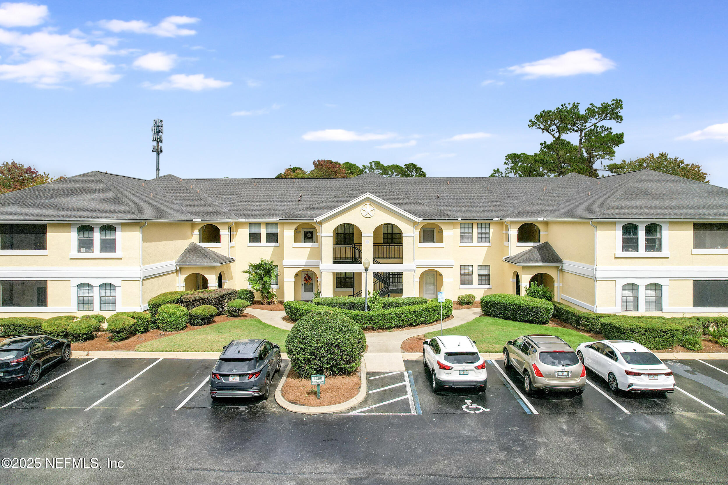 1125 Vista Cove Road St. Augustine, FL 32084 - Photo 38 of 62 a view of a patio with couches table and chairs under an umbrella with potted plants