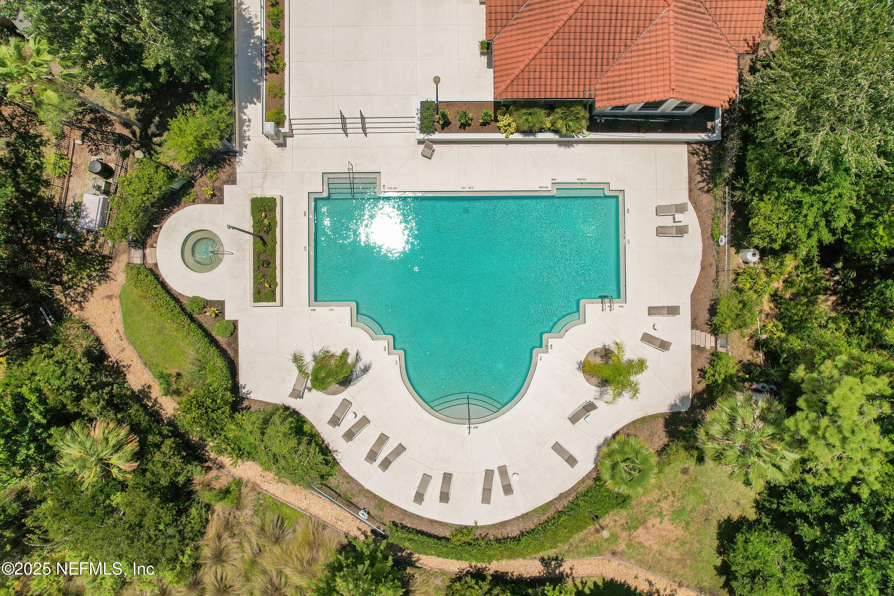 1125 Vista Cove Road St. Augustine, FL 32084 - Photo 45 of 62 an aerial view of a swimming pool with outdoor seating and yard