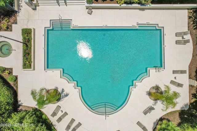 a kitchen with a stove a sink and a window