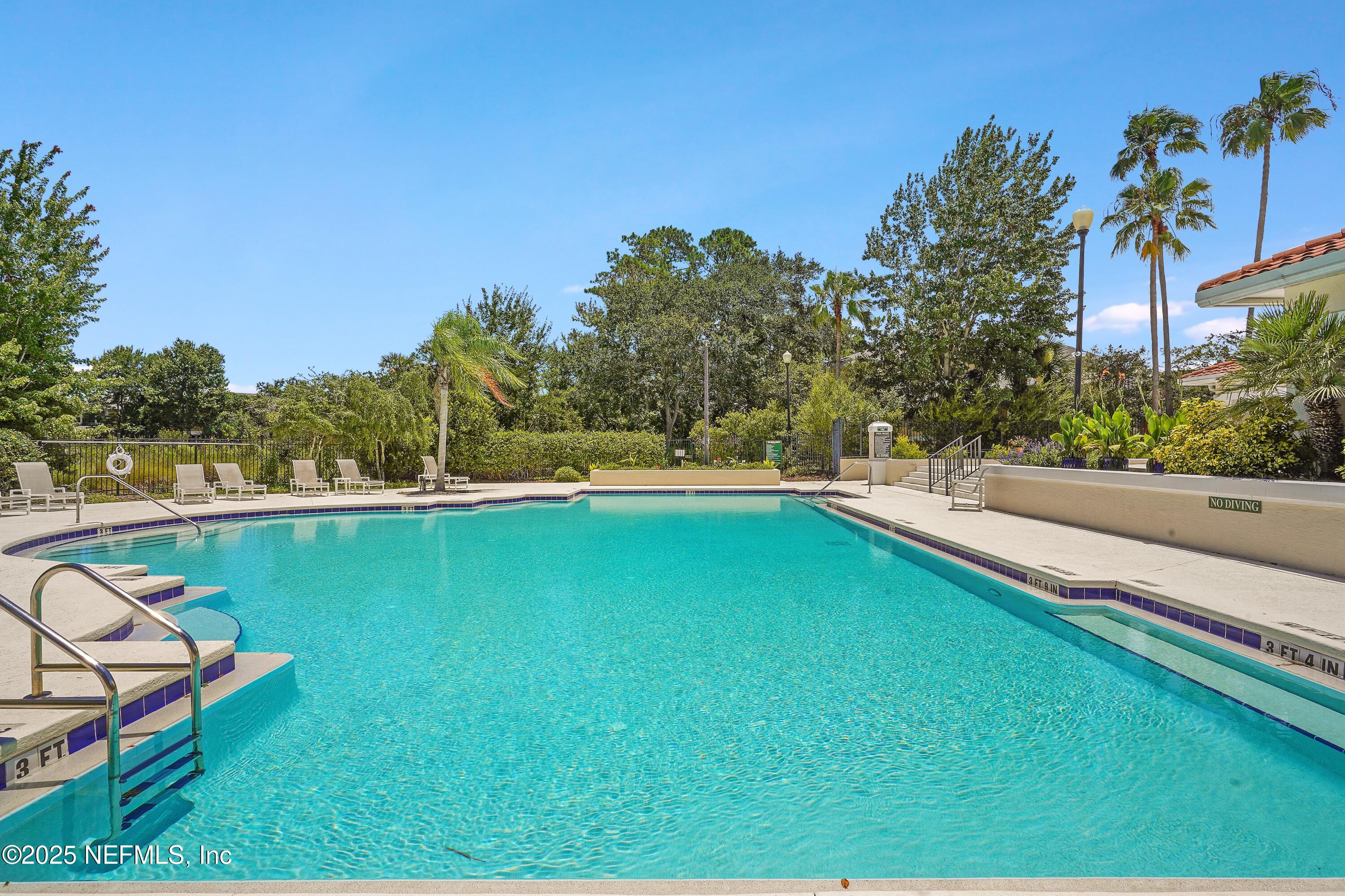 1125 Vista Cove Road St. Augustine, FL 32084 - Photo 50 of 62 a view of a swimming pool with a yard