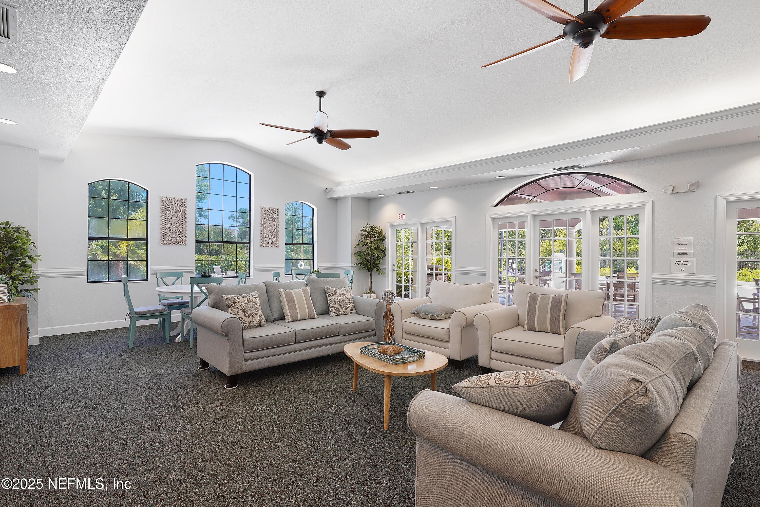 1125 Vista Cove Road St. Augustine, FL 32084 - Photo 54 of 62 a living room with furniture and a large window