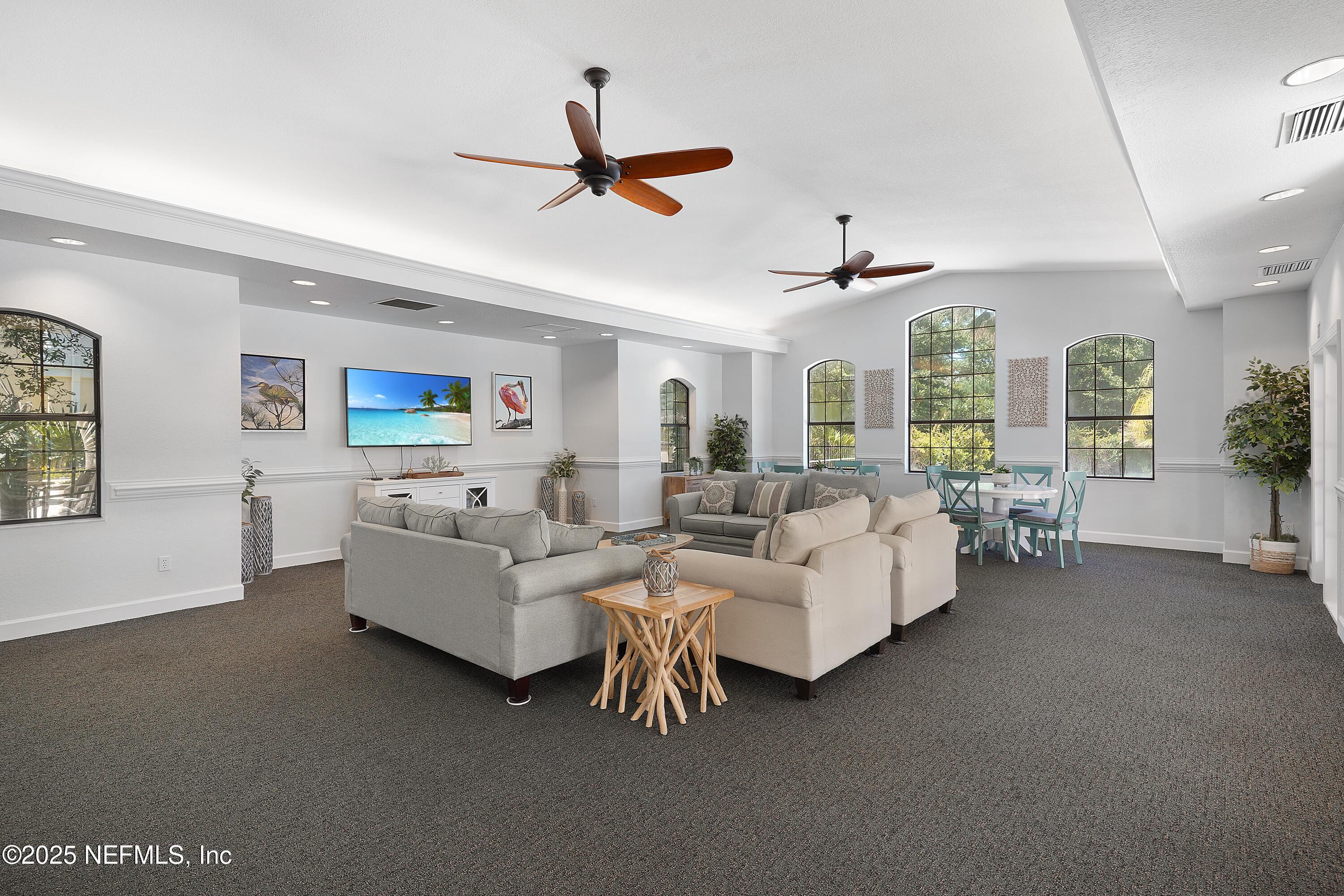 1125 Vista Cove Road St. Augustine, FL 32084 - Photo 55 of 62 a living room with furniture and a ceiling fan