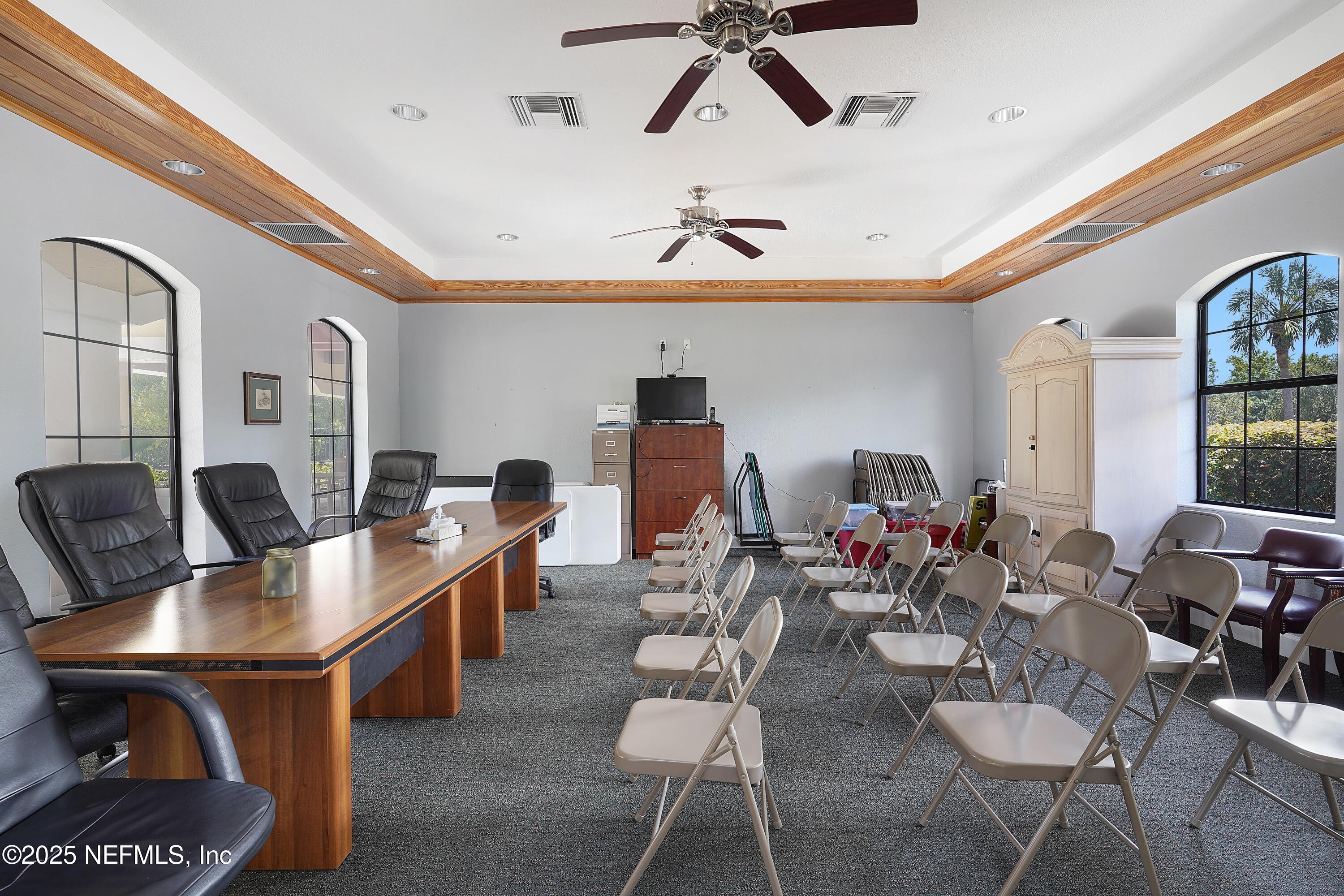 1125 Vista Cove Road St. Augustine, FL 32084 - Photo 59 of 62 a living room with couches and kitchen view with wooden floor