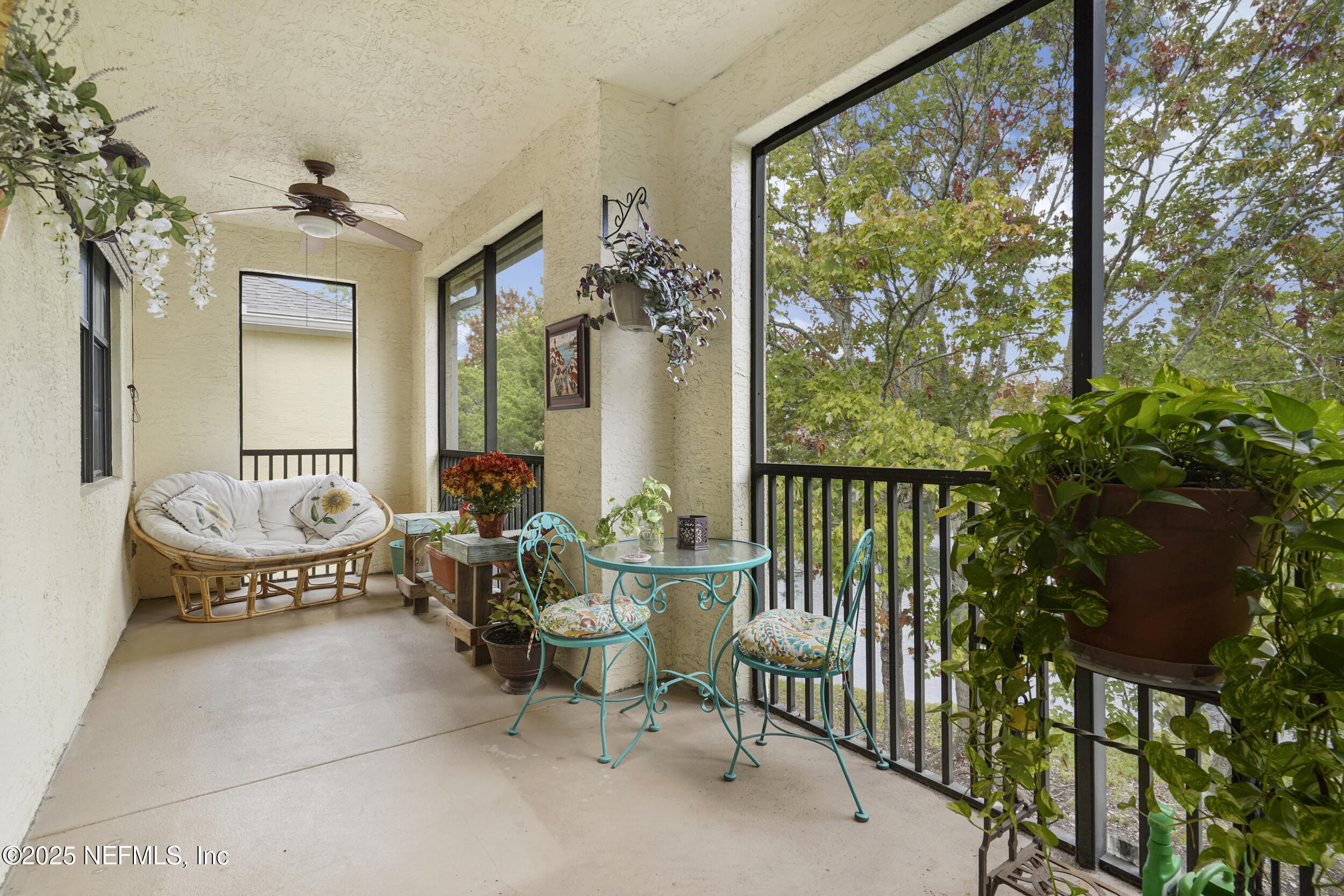 1125 Vista Cove Road St. Augustine, FL 32084 - Photo 7 of 62 a balcony with chairs and a potted plant