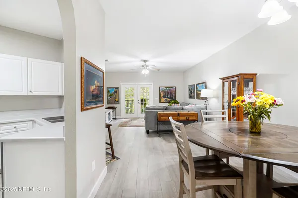 a kitchen with stainless steel appliances a refrigerator sink and microwave