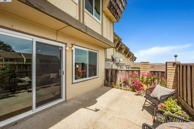 a view of a chairs and table in a patio