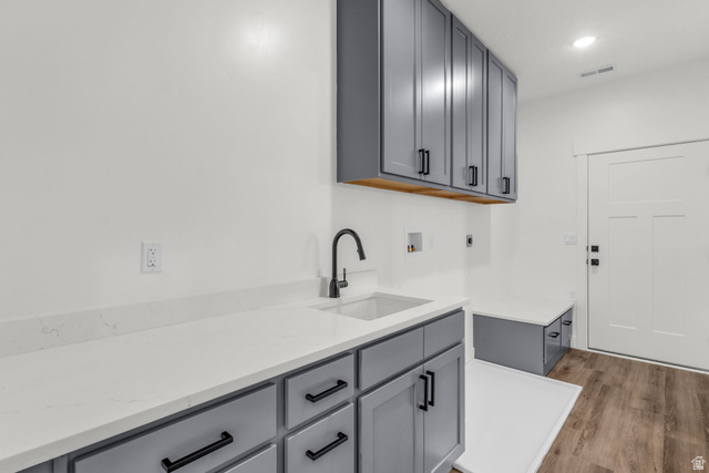 520 East 450th Street North Delta, UT 84624 - Photo 27 of 48 Laundry area featuring washer hookup, wood finished floors, cabinet space, and recessed lighting