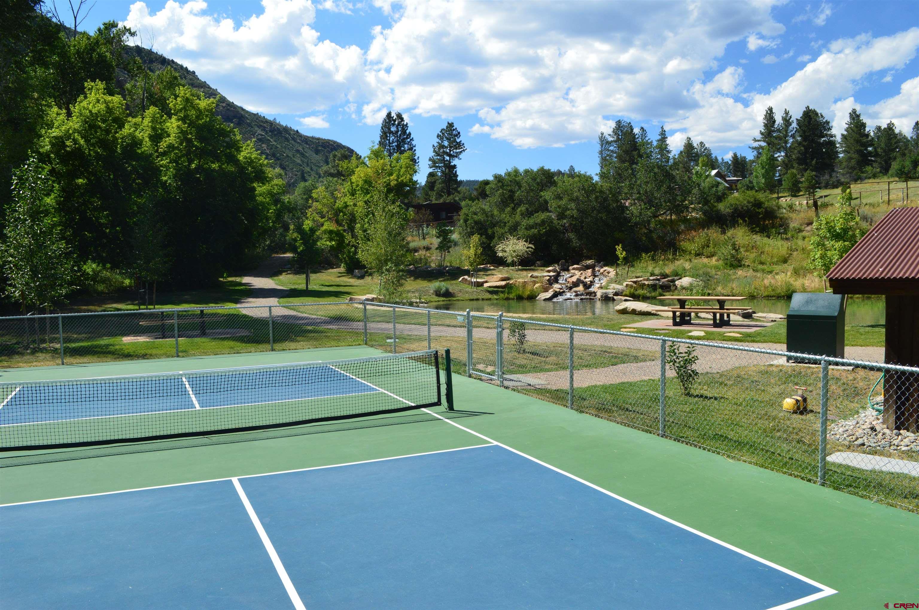 64 Snowdrop Court Durango, CO 81301 - Photo 14 of 16 a view of a swimming pool with a yard and sitting area