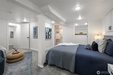 a bedroom with a bed and a couch