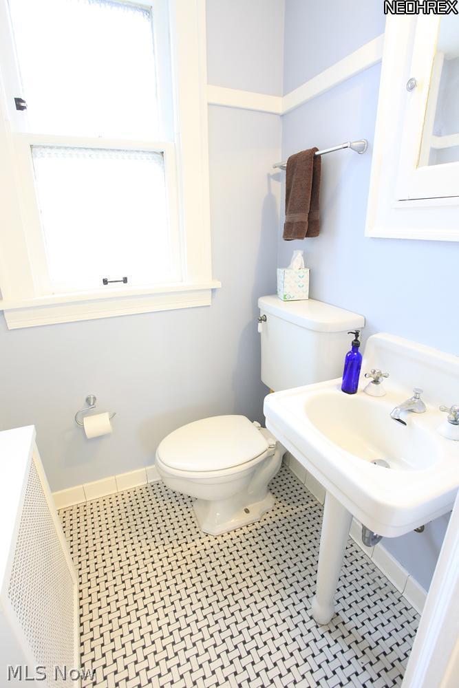 15803 Fernway Road Cleveland, OH 44120 - Photo 11 of 25 The First Floor Powder Room is just right for freshening up! With original tile flooring, the old and the new perfectly meet in this little space!