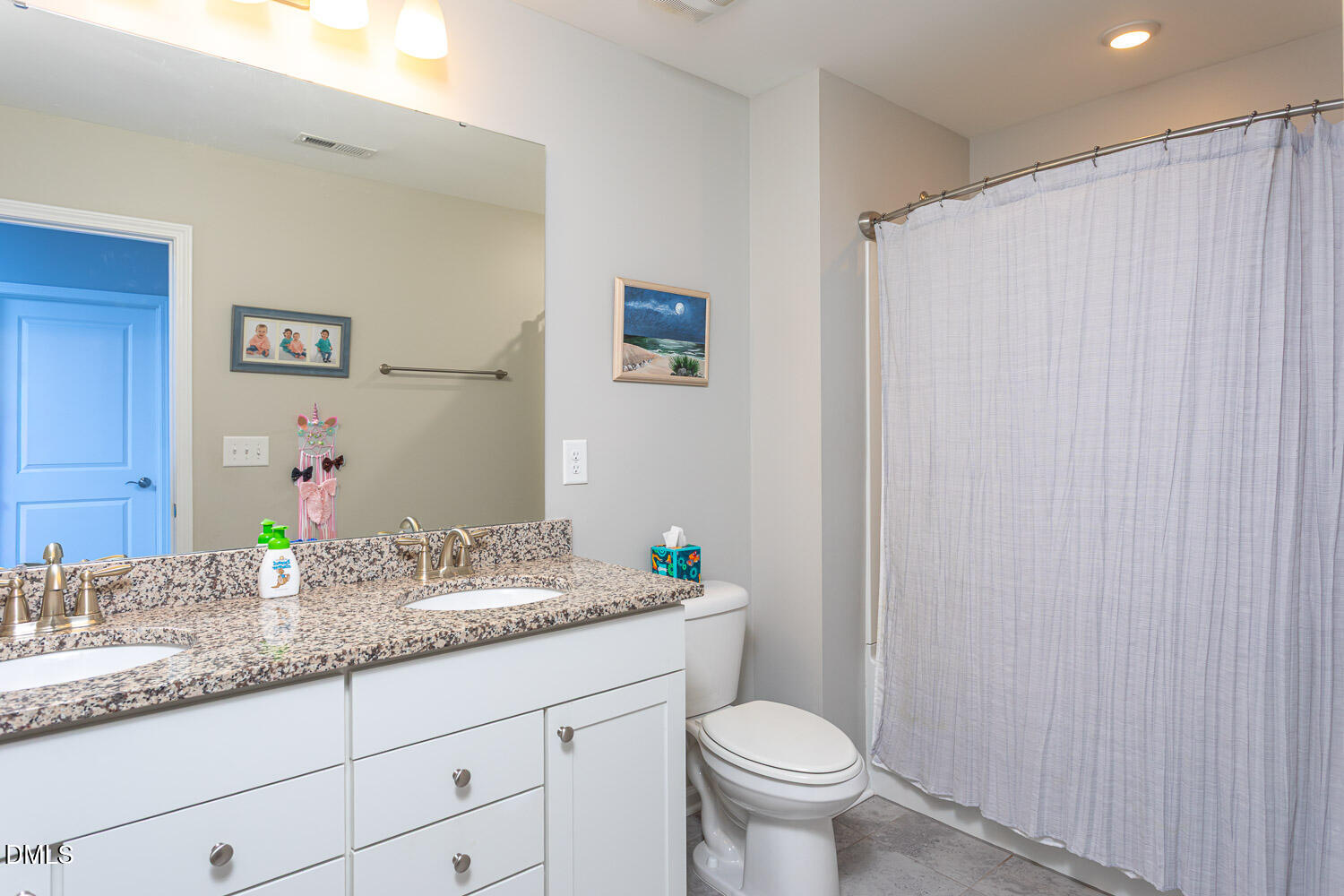 1708 Highpoint Street Wake Forest, NC 27587 - Photo 32 of 63 a bathroom with a granite countertop sink and a mirror