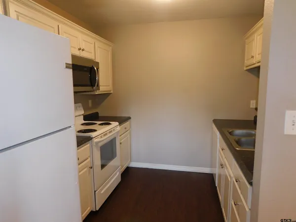 a kitchen with a stove and a microwave