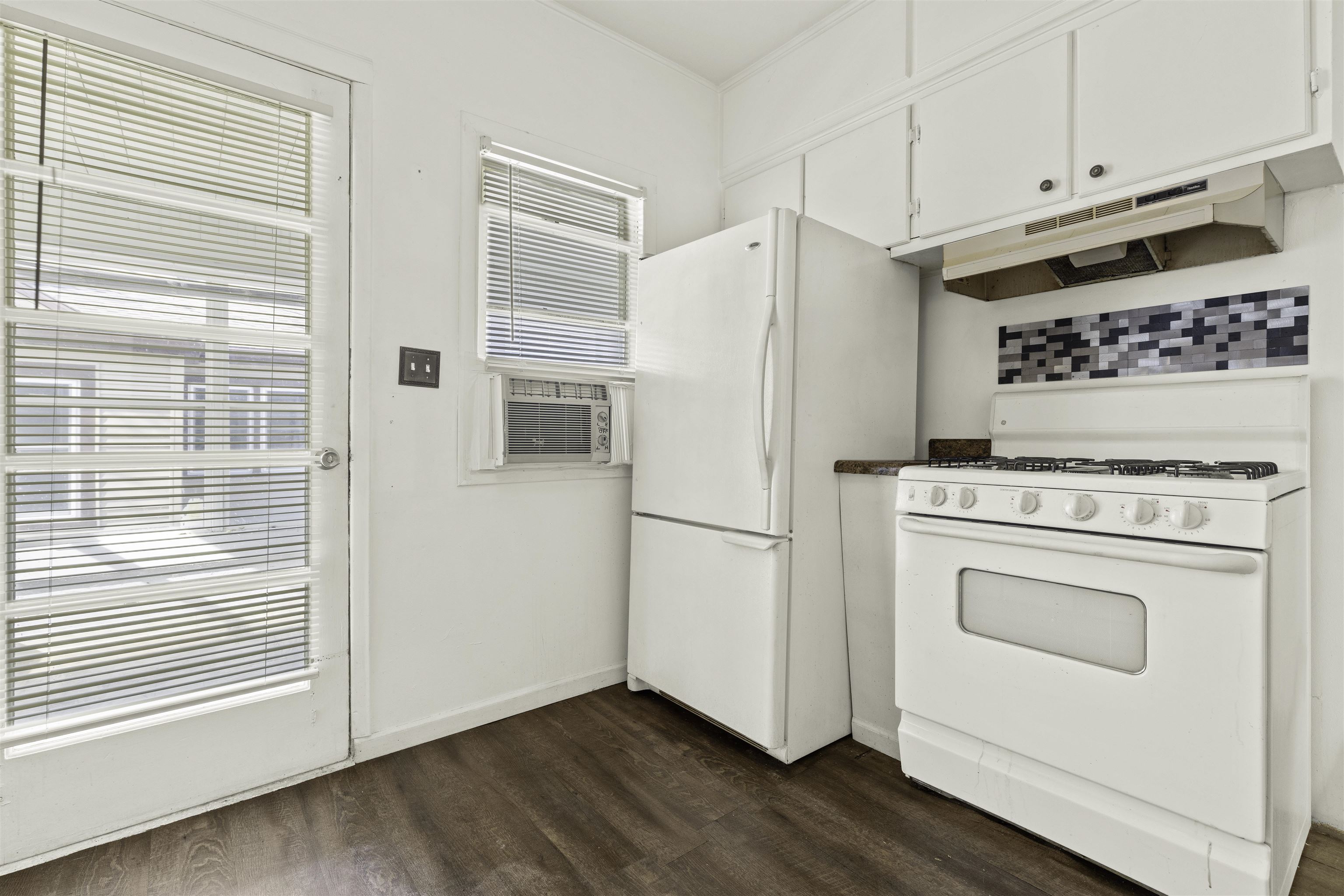 5745 Park Ridge Road Loves Park, IL 61111 - Photo 8 of 16 a white refrigerator freezer and a stove sitting inside of a kitchen