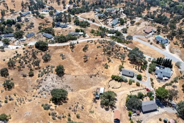 an aerial view of house with yard