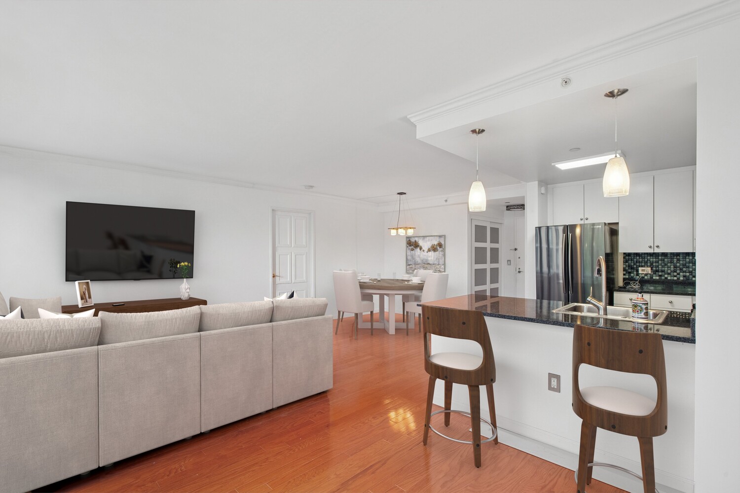 455 Main Street, Unit 4K Manhattan, NY 10044 - Photo 2 of 16 a living room with furniture and a flat screen tv