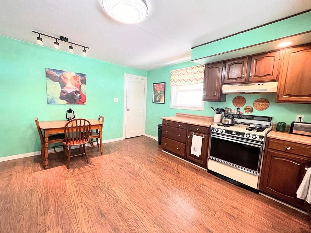 1192 Washington Street Indiana, PA 15701 - Photo 5 of 19 a kitchen with stainless steel appliances a stove a sink and a microwave