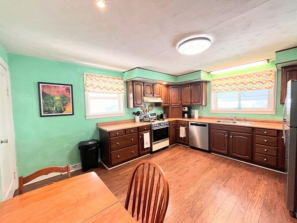 1192 Washington Street Indiana, PA 15701 - Photo 6 of 19 a kitchen with stainless steel appliances kitchen island granite countertop a stove a sink and a refrigerator