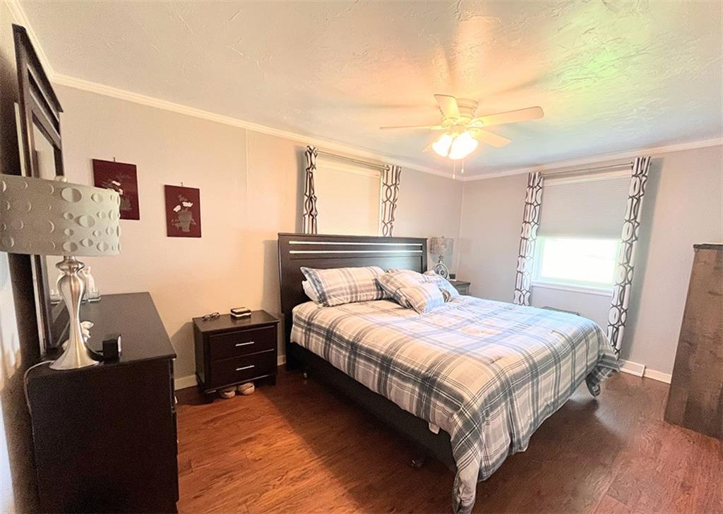 1192 Washington Street Indiana, PA 15701 - Photo 8 of 19 a bedroom with a bed and wooden floor