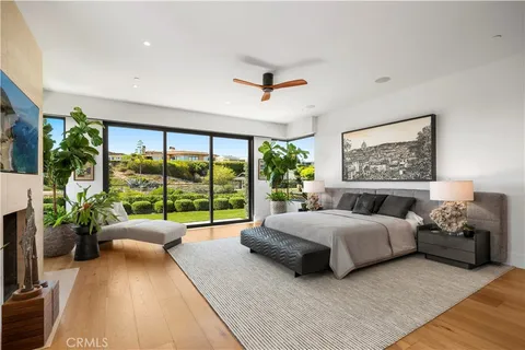 a bedroom with a large bed and a large window