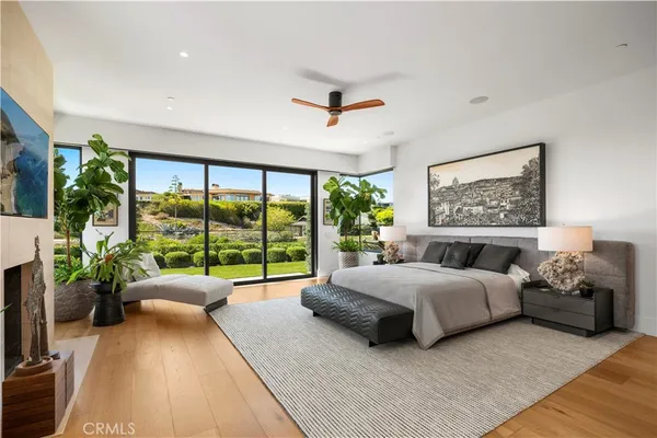 a bedroom with a large bed and a large window
