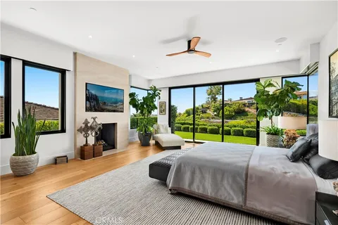 a bed room with a bed and a large window