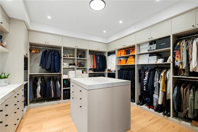 a living room with lots of furniture and closet