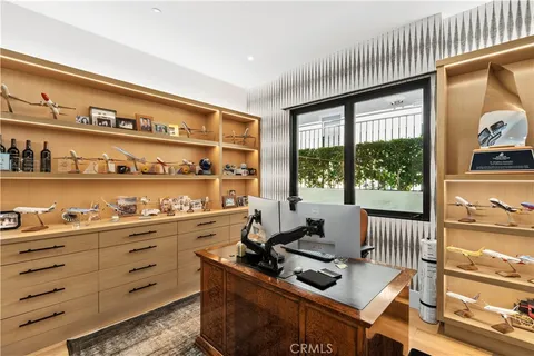 a room with furniture cabinets and window